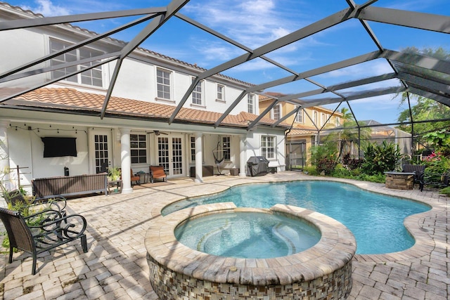 3434 Vanderbilt Dr, Wellington, FL 33414 - view of swimming pool featuring a pool with connected hot tub, french doors, a patio area, area for grilling, and a ceiling fan