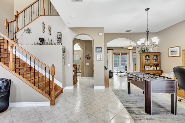 3434 Vanderbilt Dr, Wellington, FL 33414 - recreation room featuring visible vents, arched walkways, baseboards, and tile patterned flooring