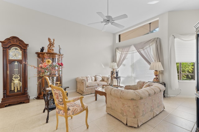 living room with a ceiling fan, light tile patterned flooring, and baseboards