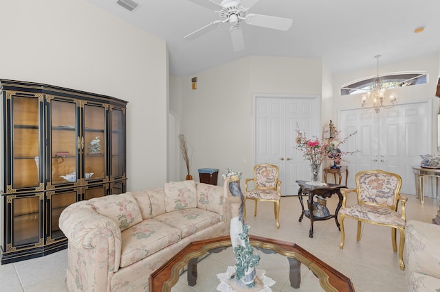 living area featuring lofted ceiling, visible vents, light tile patterned floors, and ceiling fan with notable chandelier