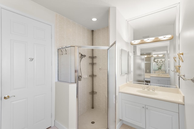full bath with a shower stall and vanity