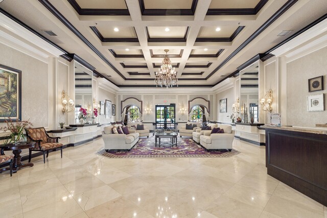 living room featuring coffered ceiling, beam ceiling, a chandelier, a towering ceiling, and ornamental molding