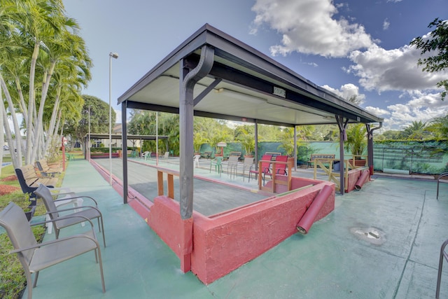 view of patio featuring fence