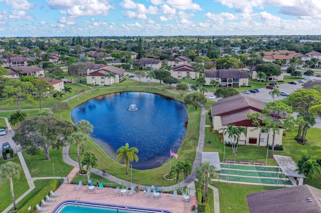 drone / aerial view with a residential view and a water view