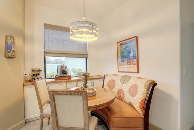 5561 1st Sq SW, Vero Beach, FL 32968 - dining space featuring a notable chandelier and light wood-type flooring