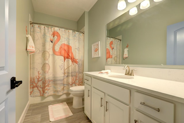 5561 1st Sq SW, Vero Beach, FL 32968 - bathroom featuring toilet, vanity, and wood finished floors