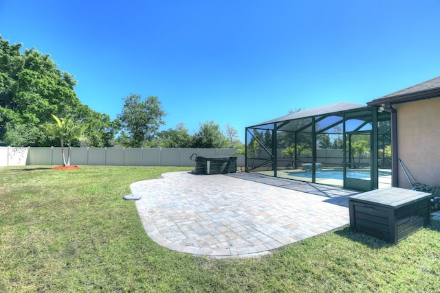 5561 1st Sq SW, Vero Beach, FL 32968 - view of yard with glass enclosure, a fenced in pool, a fenced backyard, and a patio area