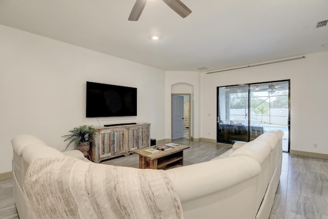 5561 1st Sq SW, Vero Beach, FL 32968 - living area featuring recessed lighting, arched walkways, baseboards, and ceiling fan