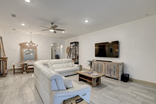 5561 1st Sq SW, Vero Beach, FL 32968 - living area with a ceiling fan, baseboards, visible vents, arched walkways, and recessed lighting