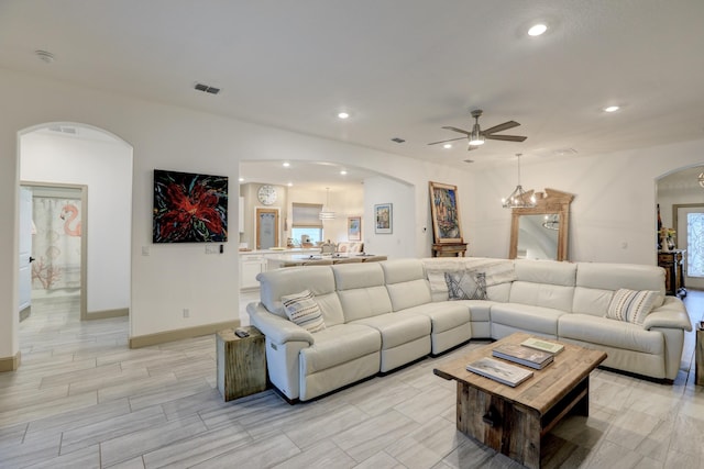 5561 1st Sq SW, Vero Beach, FL 32968 - living room featuring arched walkways, visible vents, recessed lighting, and a ceiling fan