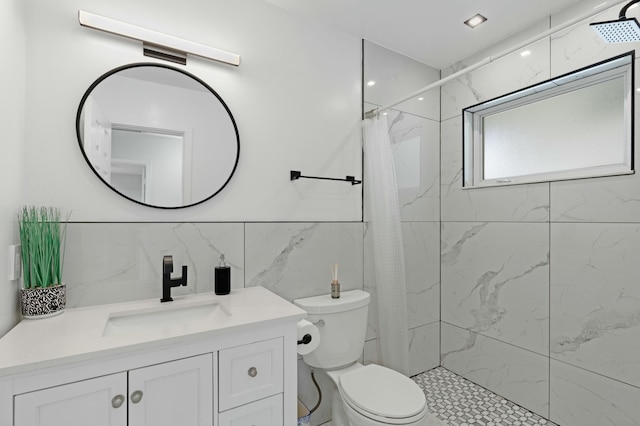 bathroom featuring a shower with curtain, tile walls, vanity, and toilet