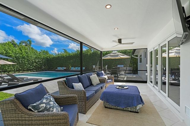 sunroom featuring a healthy amount of sunlight and ceiling fan