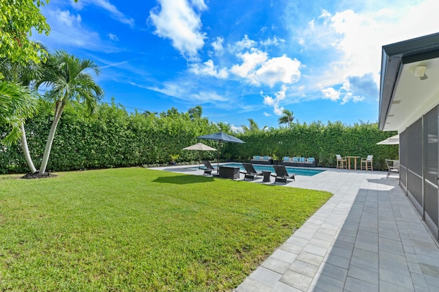 view of yard with a patio area and an outdoor pool