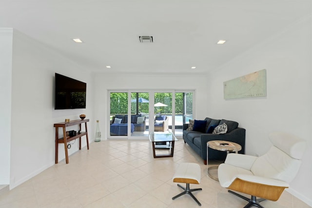 living area featuring visible vents, ornamental molding, recessed lighting, light tile patterned floors, and baseboards