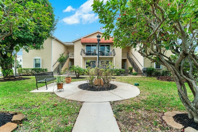 673 Waterside Dr, Hypoluxo, FL 33462 - view of property's community featuring stairs and a yard