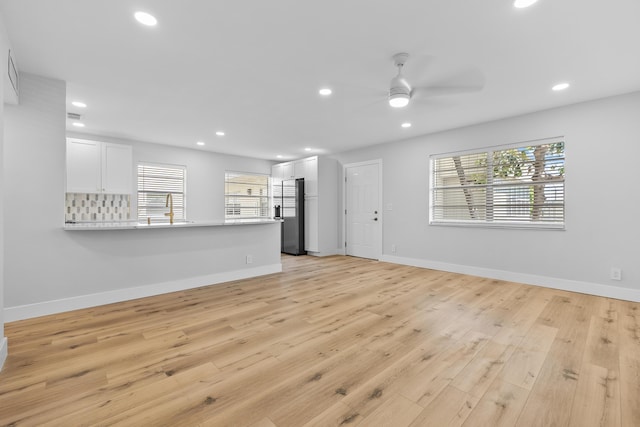 314 Monaco Unit G, Delray Beach, FL 33446 - kitchen with a sink, appliances with stainless steel finishes, a peninsula, white cabinetry, and visible vents