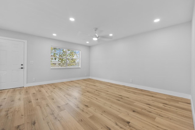 314 Monaco Unit G, Delray Beach, FL 33446 - kitchen with light stone counters, light wood finished floors, stainless steel appliances, and white cabinets