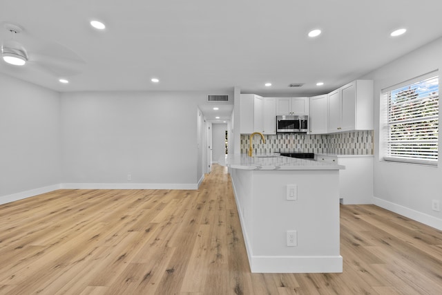 314 Monaco Unit G, Delray Beach, FL 33446 - unfurnished living room with recessed lighting, light wood-style flooring, a ceiling fan, and baseboards