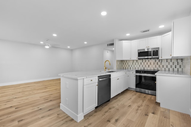 314 Monaco Unit G, Delray Beach, FL 33446 - unfurnished room with ceiling fan, baseboards, light wood-type flooring, and recessed lighting
