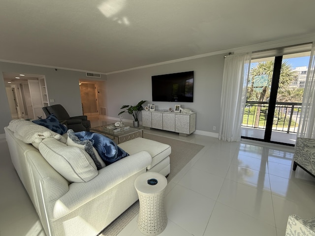 2003 N Ocean Blvd Unit 305N, Boca Raton, FL 33431 - tiled living room featuring visible vents, baseboards, and ornamental molding