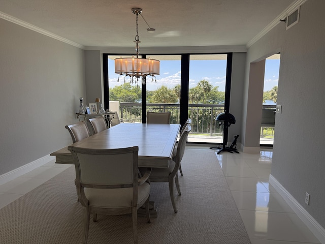 2003 N Ocean Blvd Unit 305N, Boca Raton, FL 33431 - dining room featuring crown molding, light tile patterned floors, visible vents, and a chandelier