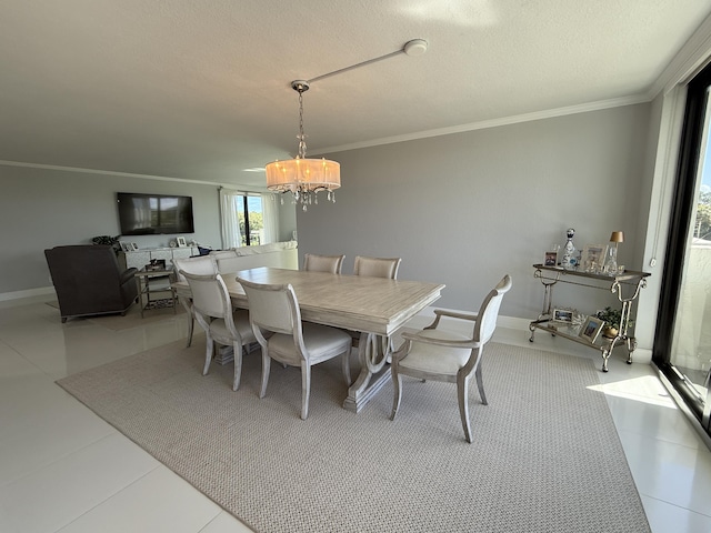 2003 N Ocean Blvd Unit 305N, Boca Raton, FL 33431 - dining area featuring baseboards, a textured ceiling, an inviting chandelier, and crown molding