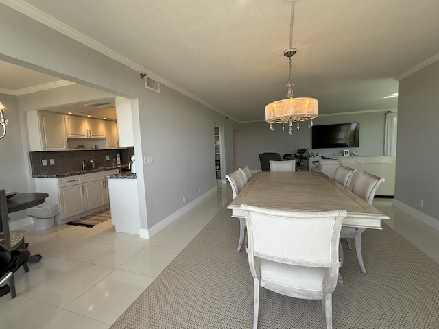2003 N Ocean Blvd Unit 305N, Boca Raton, FL 33431 - dining room with light tile patterned floors, visible vents, a chandelier, and crown molding