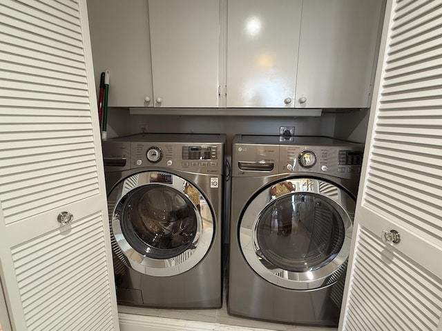 2003 N Ocean Blvd Unit 305N, Boca Raton, FL 33431 - washroom with cabinet space and separate washer and dryer