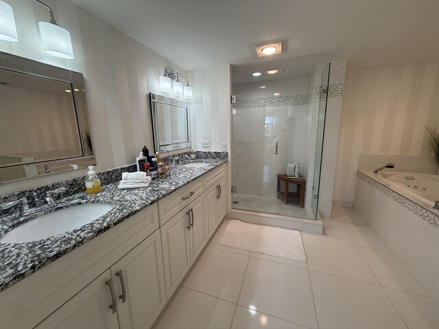 2003 N Ocean Blvd Unit 305N, Boca Raton, FL 33431 - bathroom featuring tile patterned floors, a whirlpool tub, a shower stall, and a sink