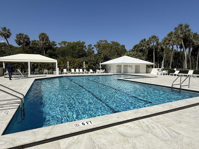 2003 N Ocean Blvd Unit 305N, Boca Raton, FL 33431 - community pool with a gazebo, a patio, and fence