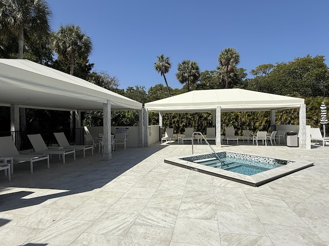 2003 N Ocean Blvd Unit 305N, Boca Raton, FL 33431 - view of pool featuring a patio