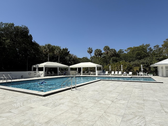 2003 N Ocean Blvd Unit 305N, Boca Raton, FL 33431 - community pool with a gazebo, a patio area, and fence