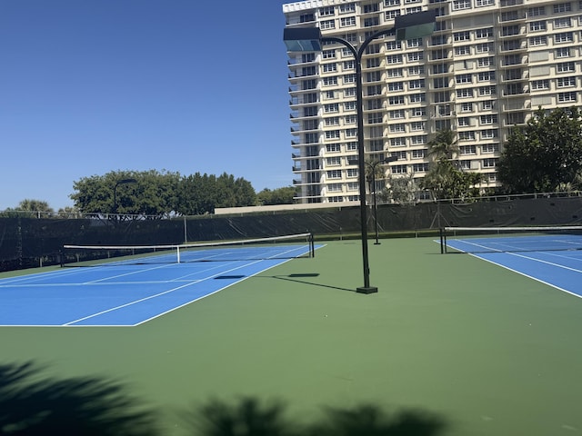 2003 N Ocean Blvd Unit 305N, Boca Raton, FL 33431 - view of sport court featuring community basketball court and fence