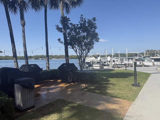 2003 N Ocean Blvd Unit 305N, Boca Raton, FL 33431 - view of yard featuring a water view, boat lift, and a boat dock