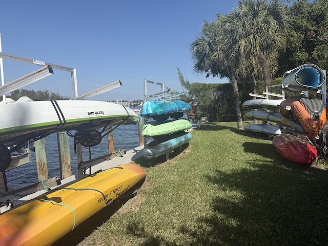 2003 N Ocean Blvd Unit 305N, Boca Raton, FL 33431 - view of yard with boat lift, a boat dock, and a water view