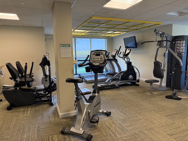2003 N Ocean Blvd Unit 305N, Boca Raton, FL 33431 - workout area with baseboards, a paneled ceiling, and carpet