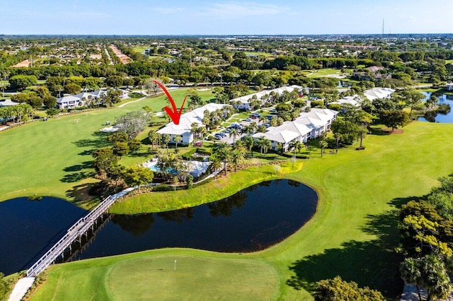 birds eye view of property featuring a water view and golf course view