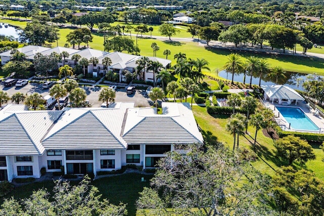drone / aerial view with a water view and a residential view
