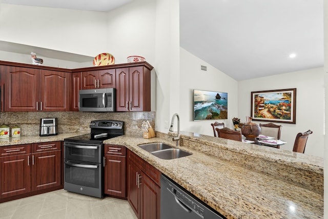 3251 Perimeter Dr, Greenacres, FL 33467 - kitchen with backsplash, light stone counters, appliances with stainless steel finishes, and a sink