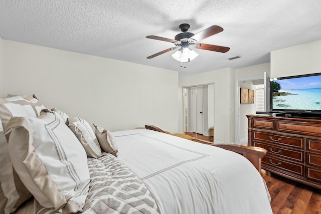 3251 Perimeter Dr, Greenacres, FL 33467 - bedroom featuring visible vents, a textured ceiling, ceiling fan, and dark wood-style flooring
