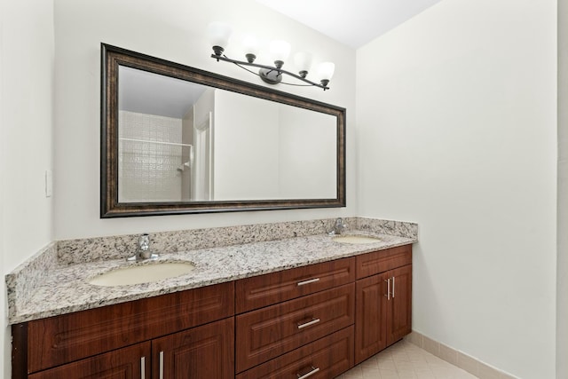 3251 Perimeter Dr, Greenacres, FL 33467 - bathroom featuring double vanity, baseboards, and a sink