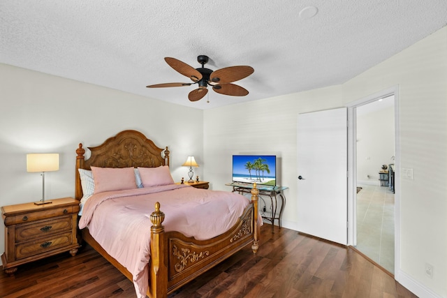 3251 Perimeter Dr, Greenacres, FL 33467 - bedroom with a textured ceiling, wood finished floors, and a ceiling fan