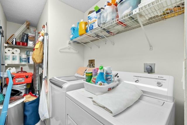3251 Perimeter Dr, Greenacres, FL 33467 - laundry room featuring a textured ceiling, laundry area, and washer and clothes dryer