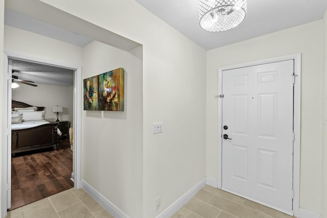 3251 Perimeter Dr, Greenacres, FL 33467 - entryway with light tile patterned floors, ceiling fan, and baseboards