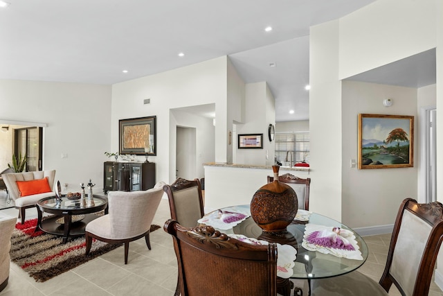 3251 Perimeter Dr, Greenacres, FL 33467 - dining space with light tile patterned floors, baseboards, lofted ceiling, and recessed lighting