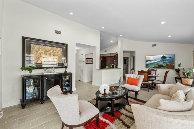 3251 Perimeter Dr, Greenacres, FL 33467 - living area featuring lofted ceiling, wine cooler, recessed lighting, and visible vents