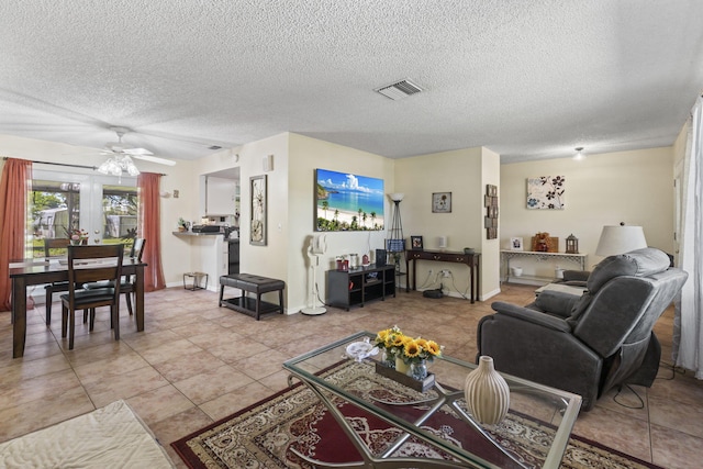 7003 Arthurs Rd, Fort Pierce, FL 34951 - living area featuring baseboards, a ceiling fan, visible vents, and a textured ceiling