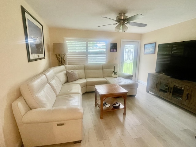4142 NE Robin Ct, Jensen Beach, FL 34957 - living room with ceiling fan and light wood-style flooring