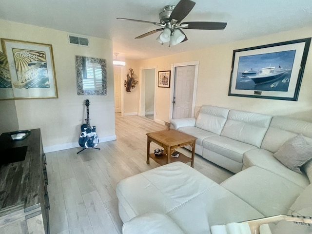 4142 NE Robin Ct, Jensen Beach, FL 34957 - living room featuring wood finished floors and ceiling fan