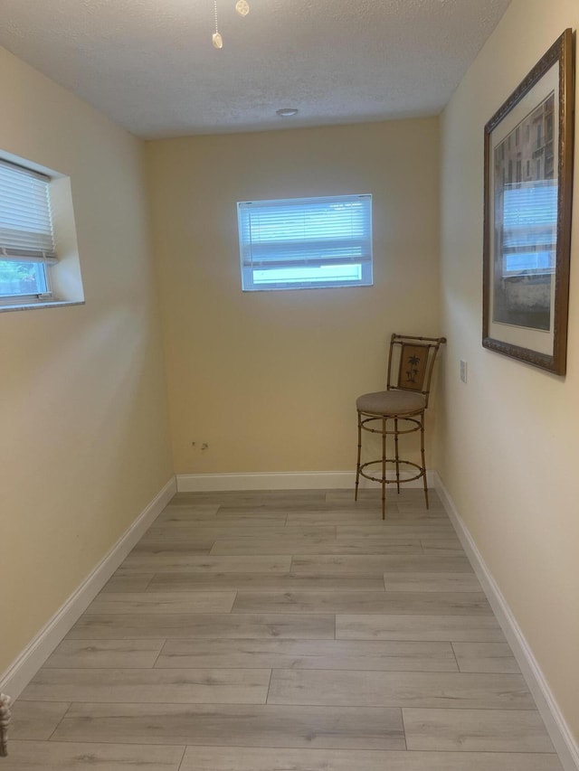4142 NE Robin Ct, Jensen Beach, FL 34957 - unfurnished room with light wood-style floors and baseboards